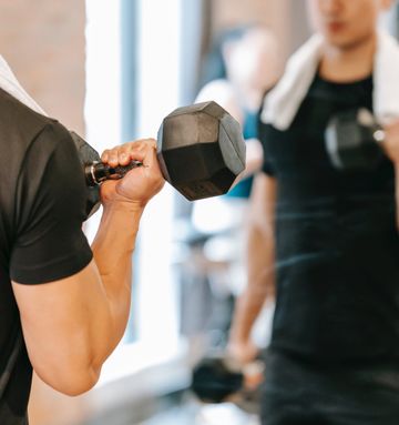 A young man is losing weight in a gym A man is losing weight in a gym